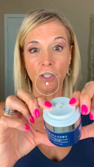 Woman with blonde hair holding a blue skincare product container